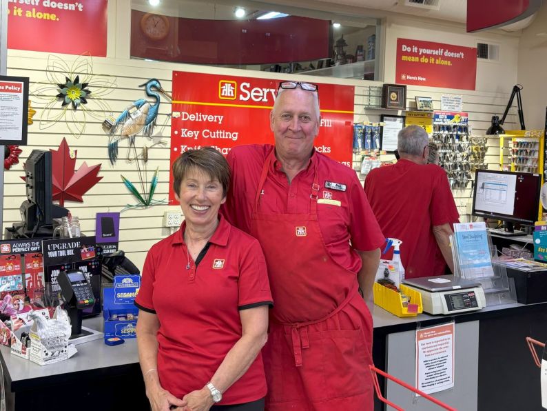 Home Hardware employees smiling at the counter.