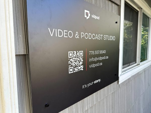 Front door sign at VidPod Studio Co. in downtown Parksville, BC