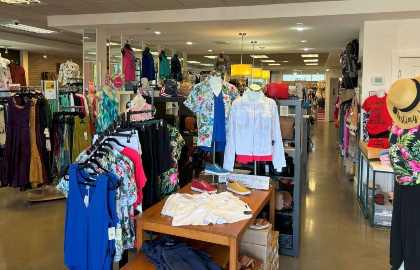Picture of the whole Close to You store with clothes, bags, and shoes.